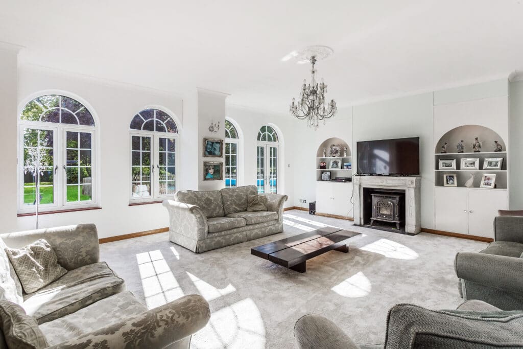 a living room filled with furniture and a fireplace