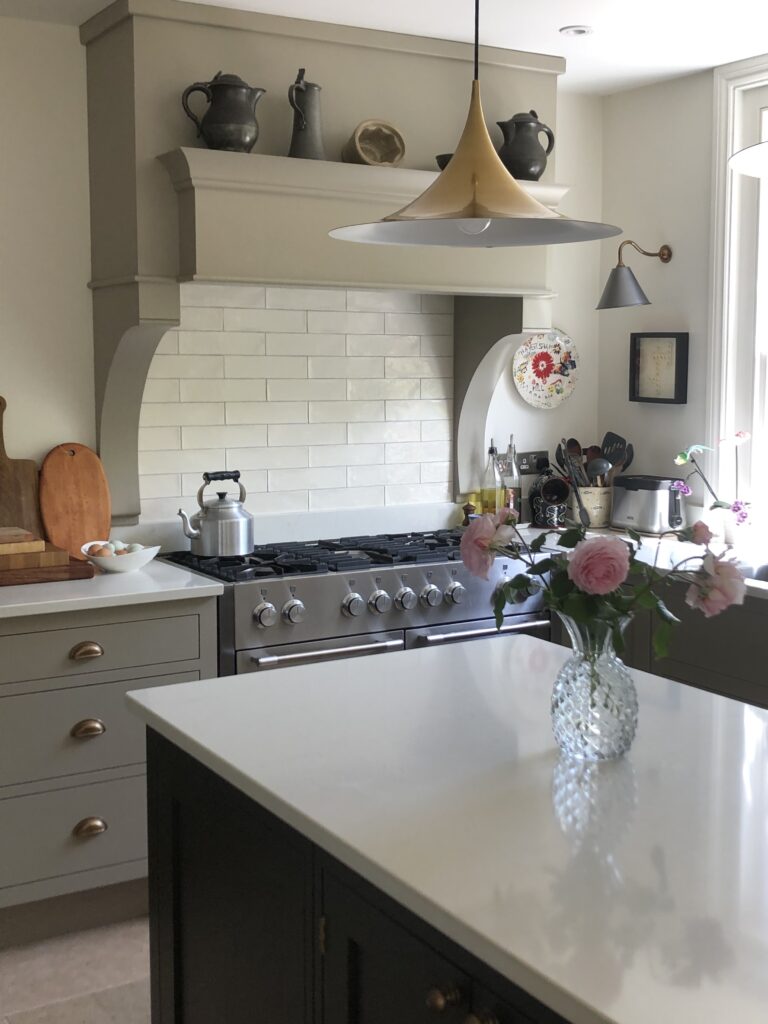 a vase of flowers on a kitchen counter