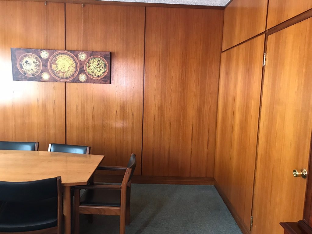 a wooden chair in a room