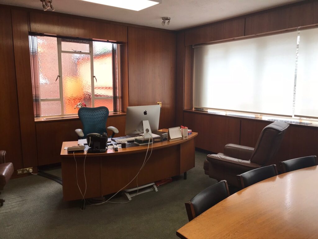 a room filled with furniture and a large window