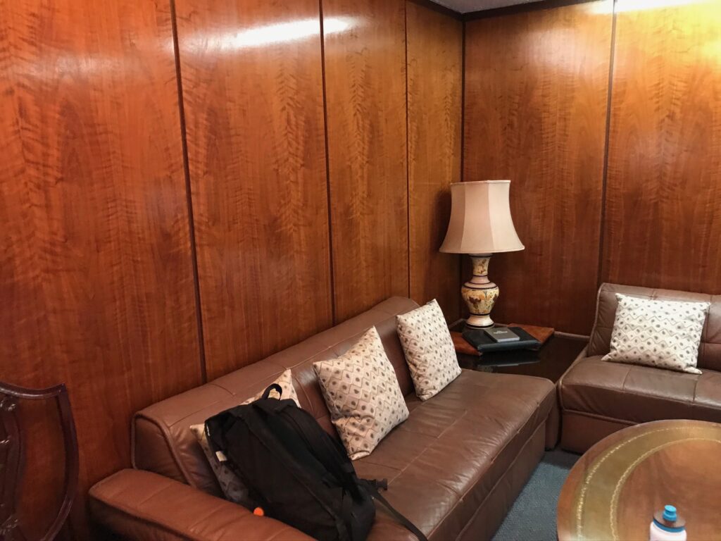 a brown leather couch in a living room