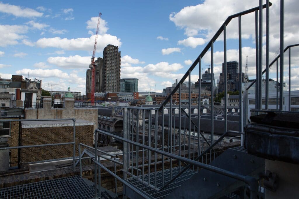 a building with a metal fence