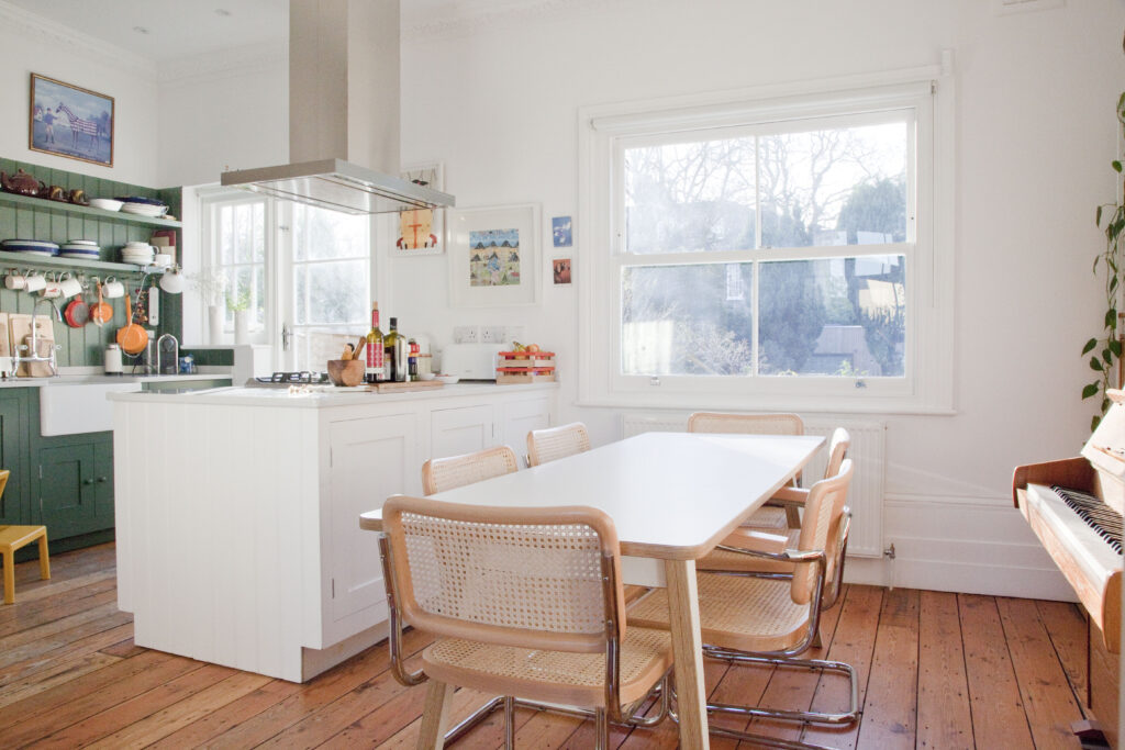 a living room filled with furniture and a large window