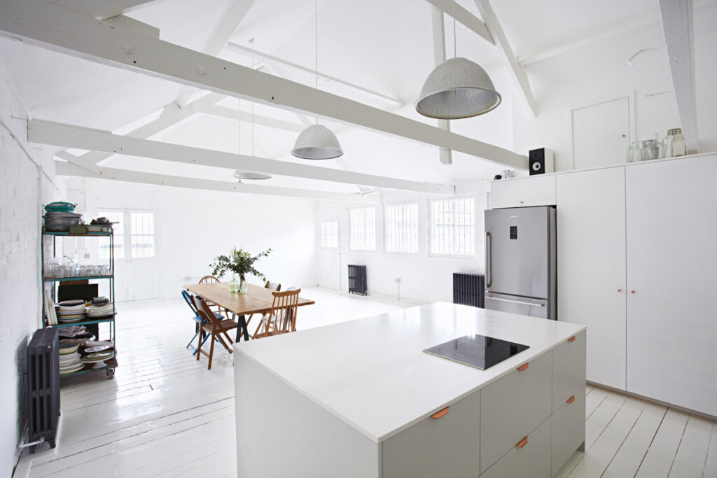 a kitchen with a table in a room