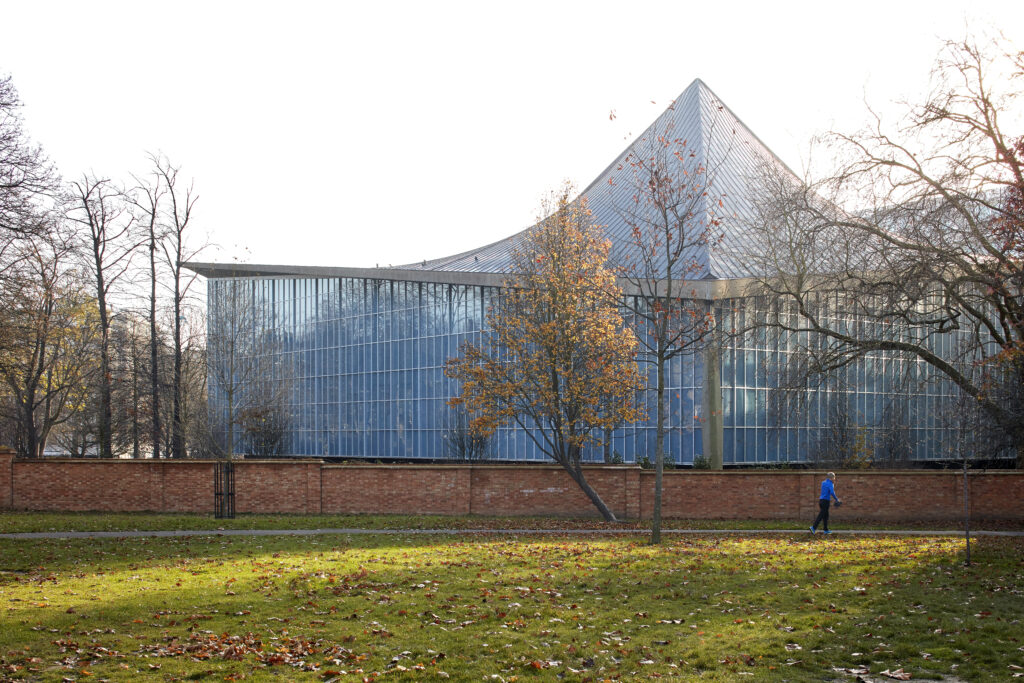 a building with a green field