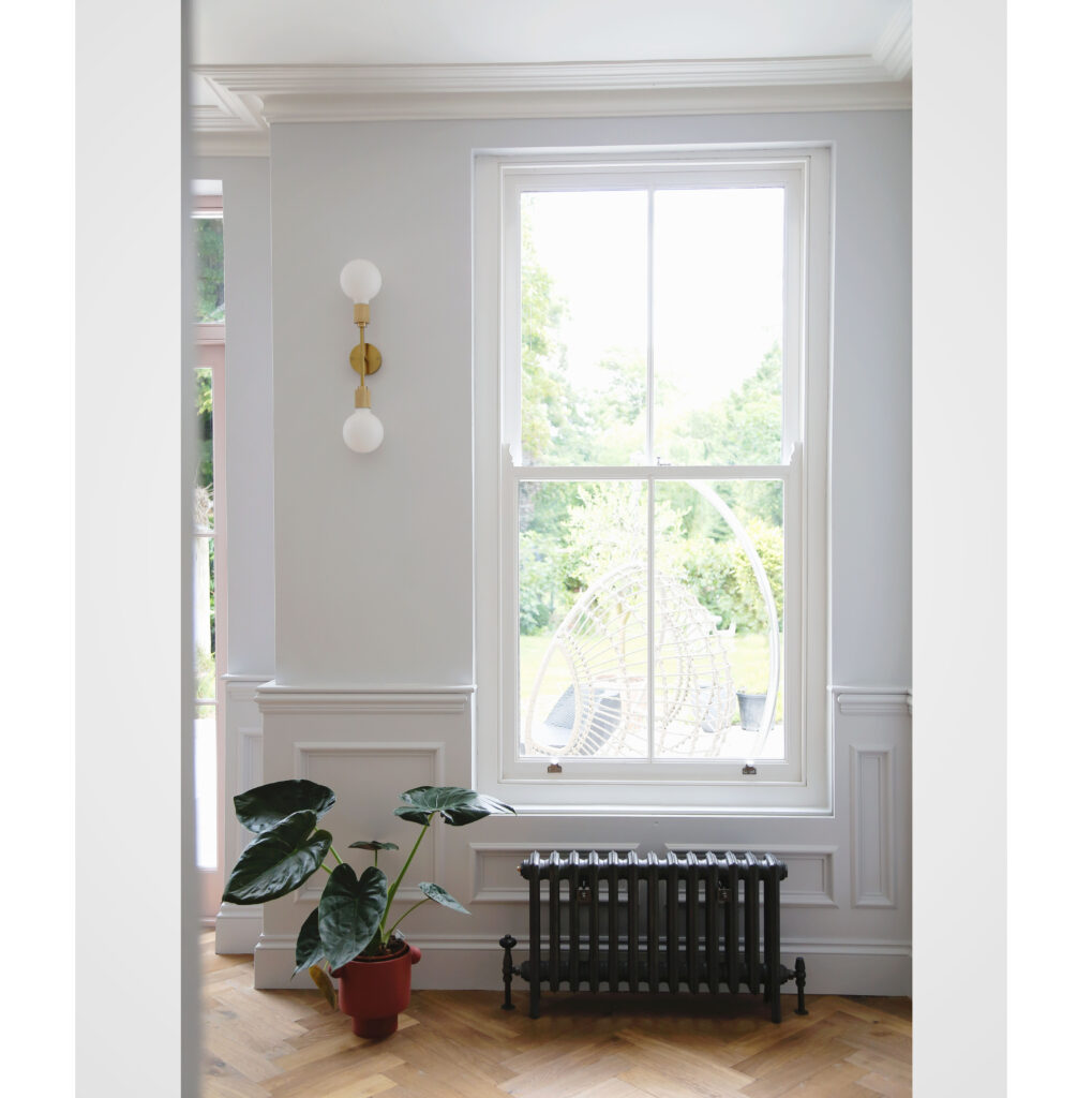 a room filled with furniture and a large window