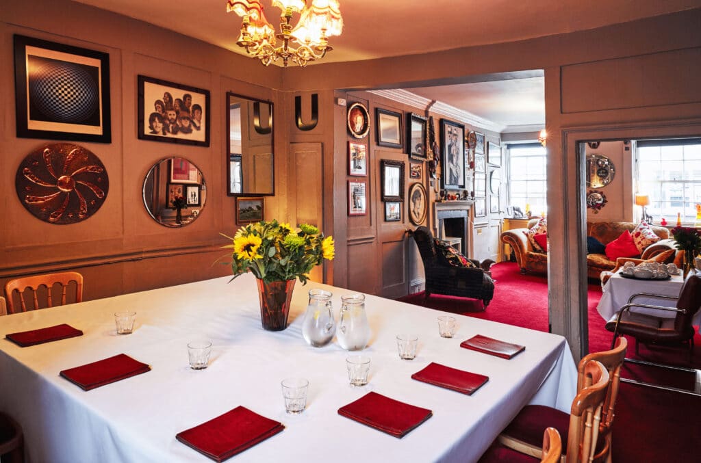 a room filled with furniture and a large window