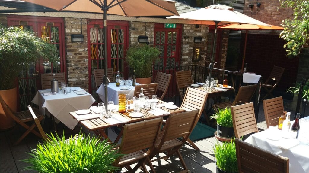 a dining table in a garden