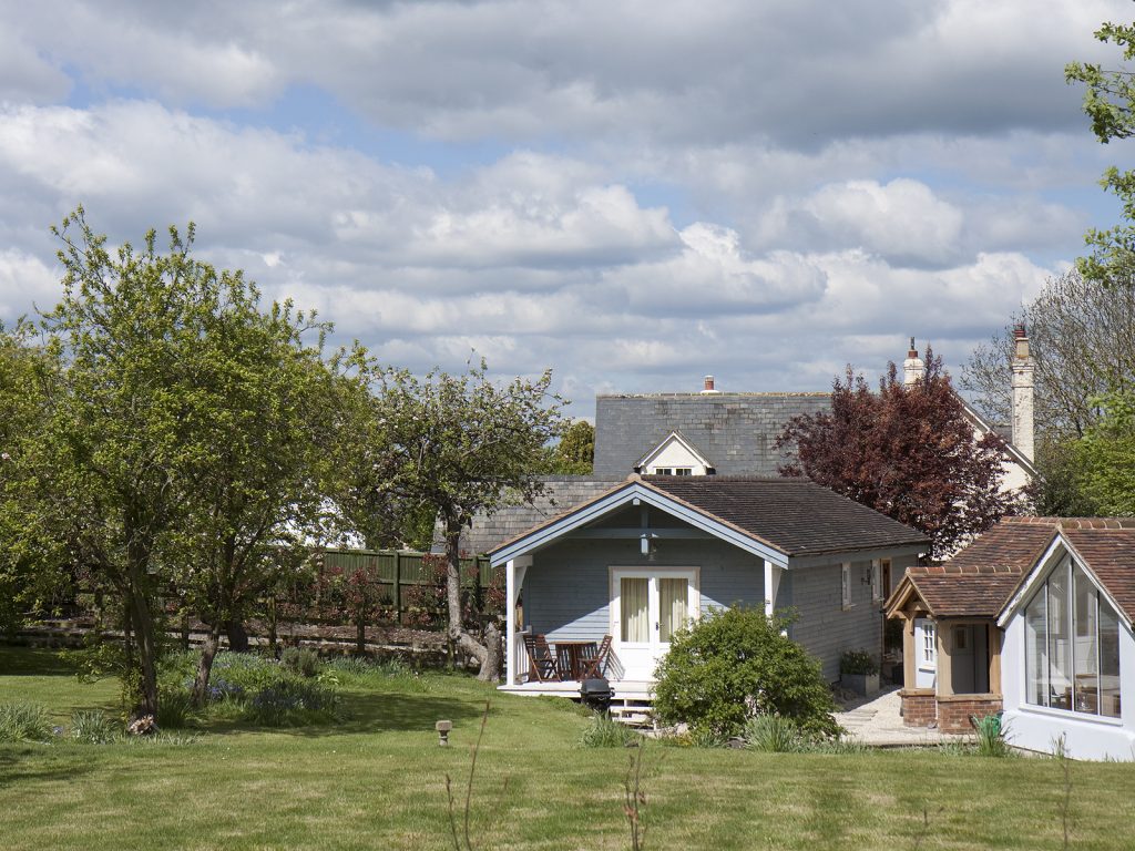 a house with trees in the background