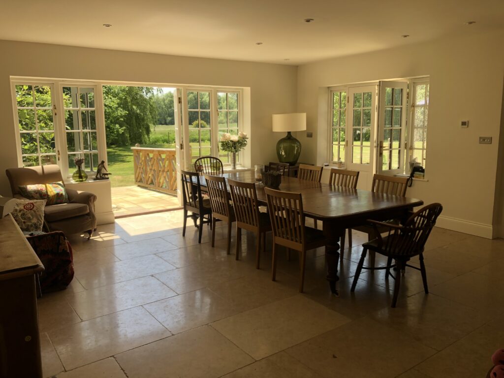 a living room filled with furniture and a large window