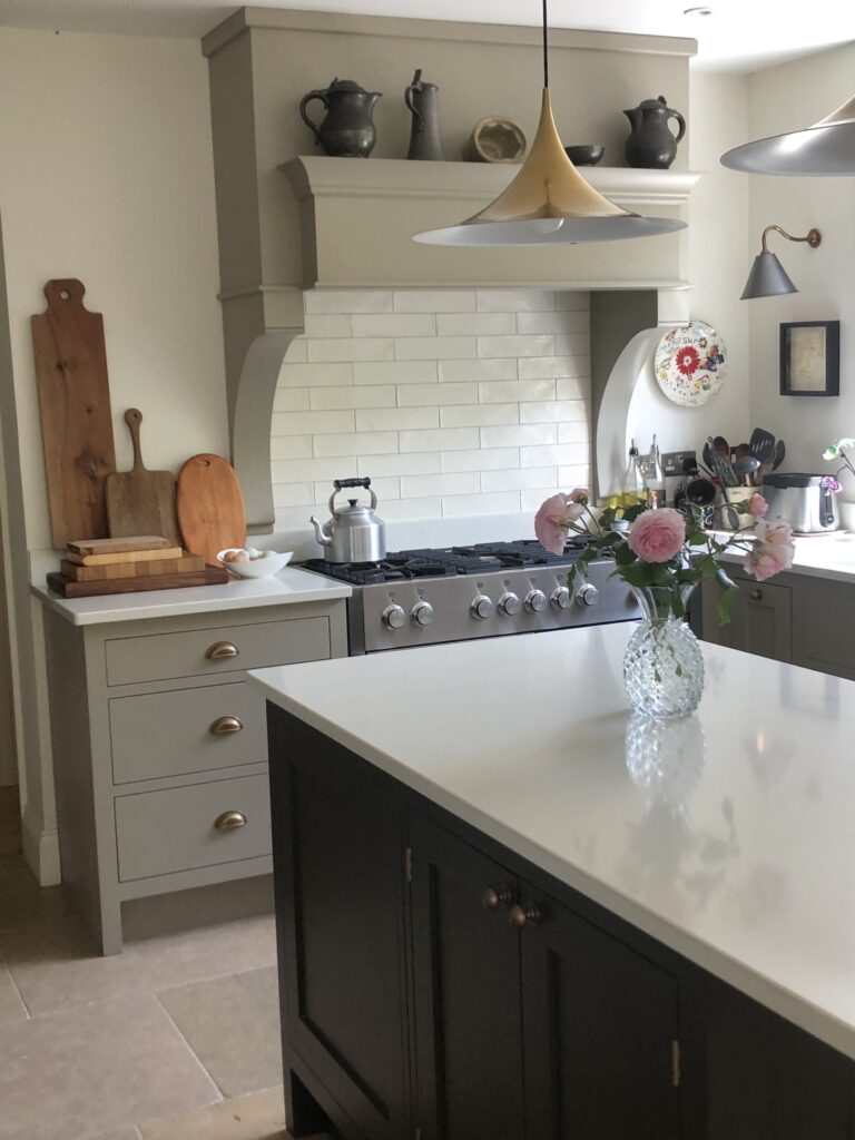 a kitchen with a sink and a mirror
