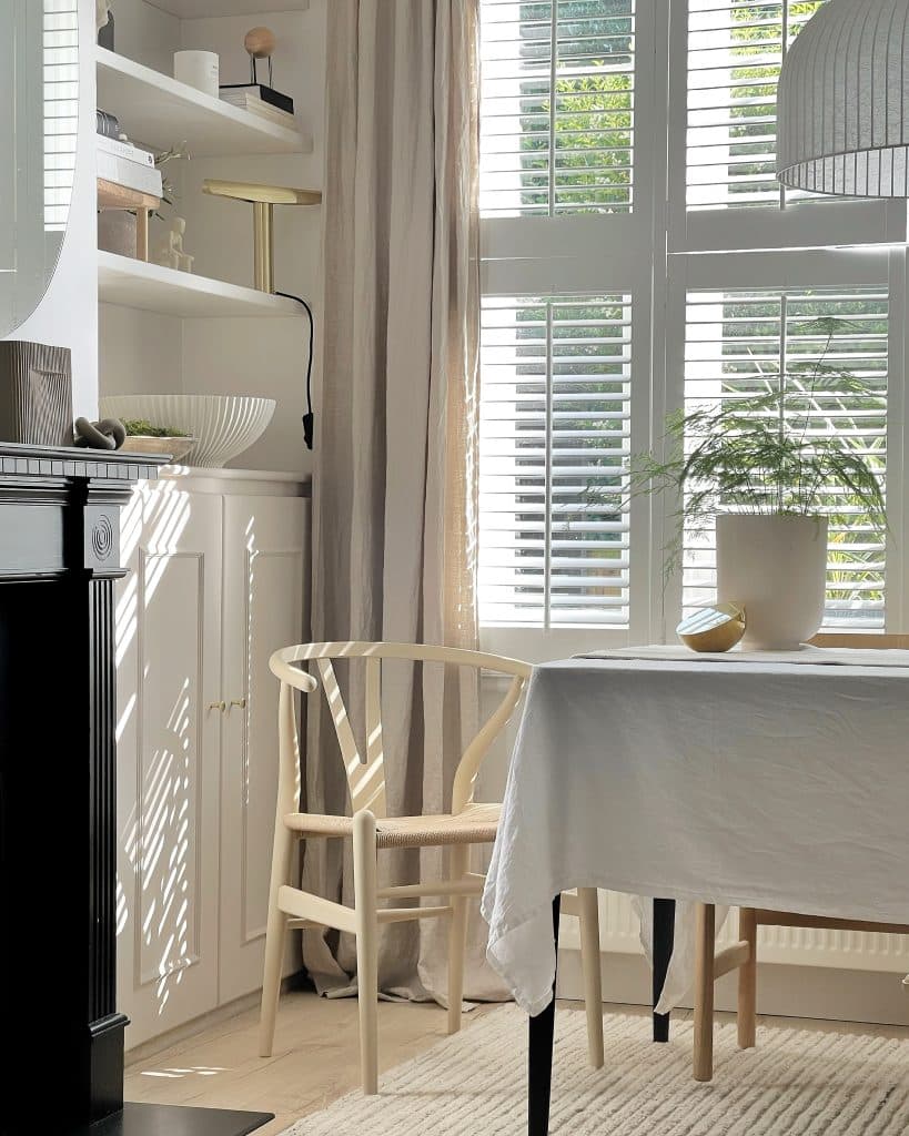 a dining room table in front of a window