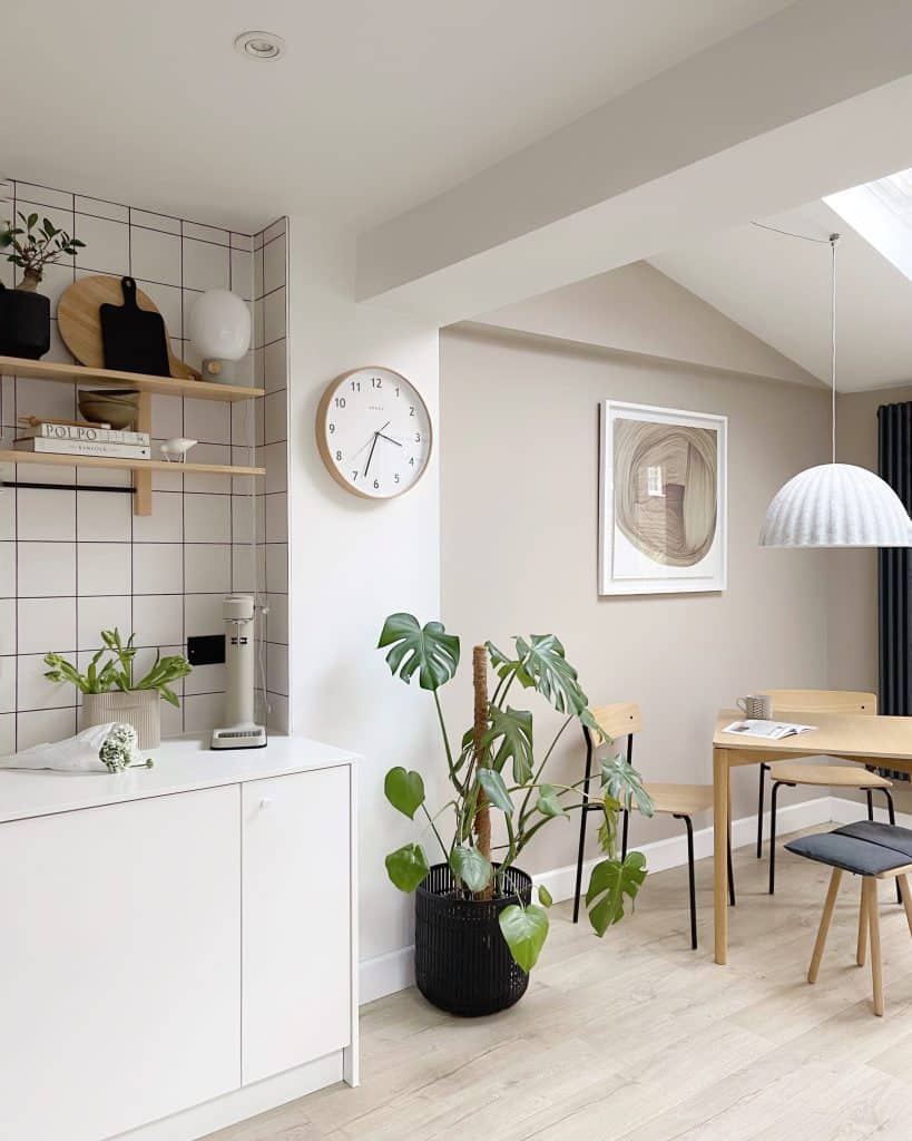 a living room filled with furniture and a clock