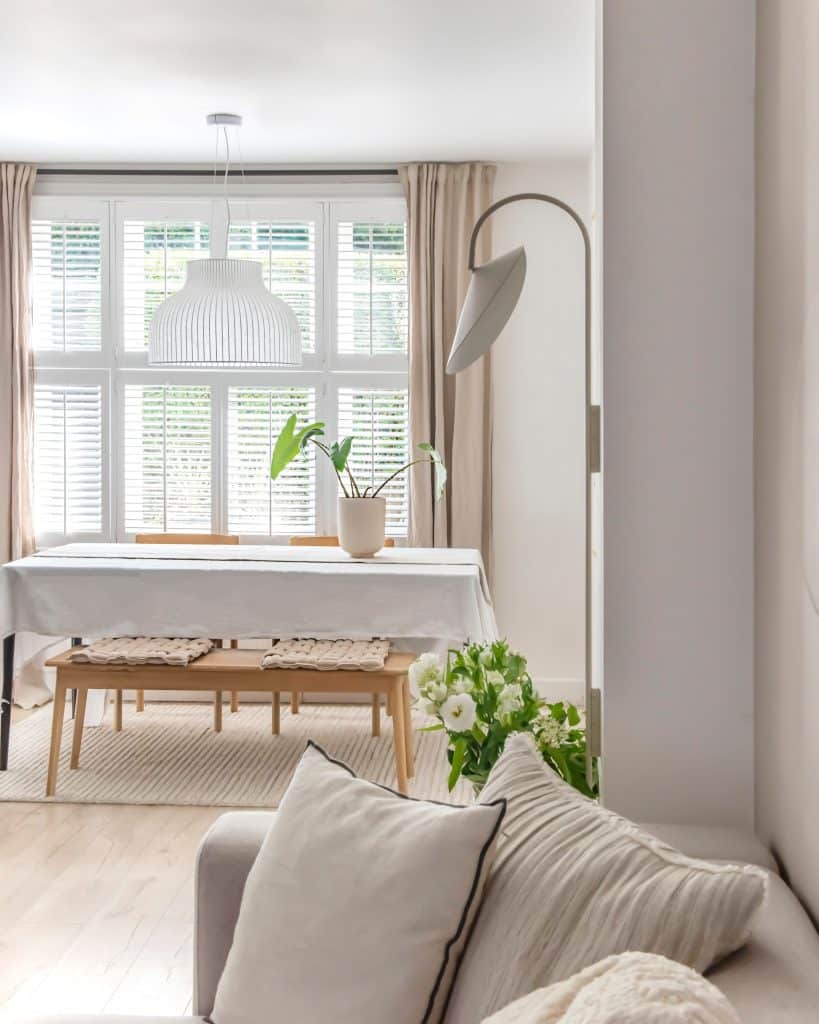 a living room filled with furniture and a large window