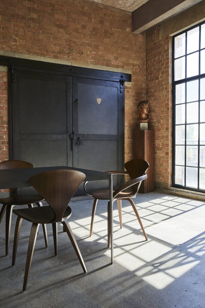 a dining room table in front of a window