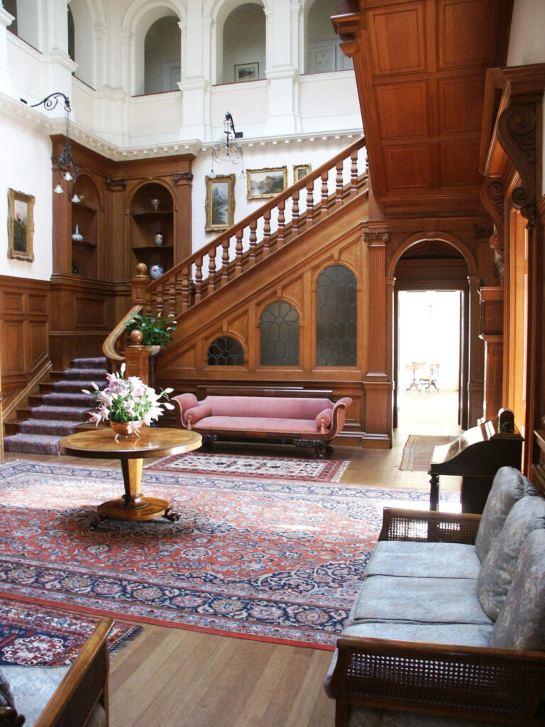 a living room filled with furniture and a fireplace