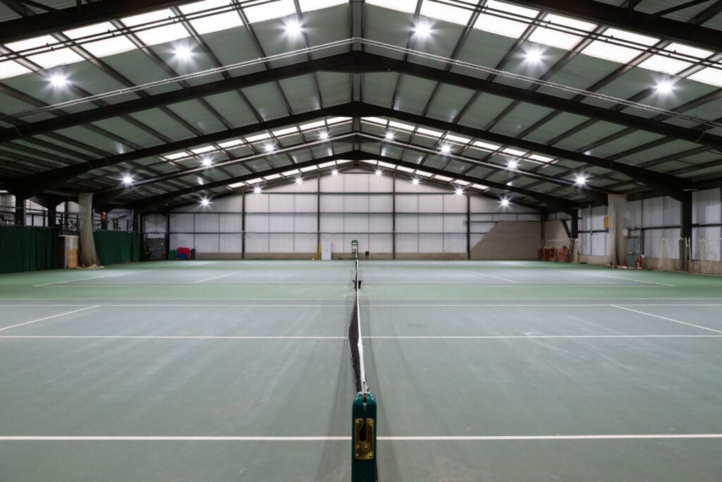 a person on a court with a racket