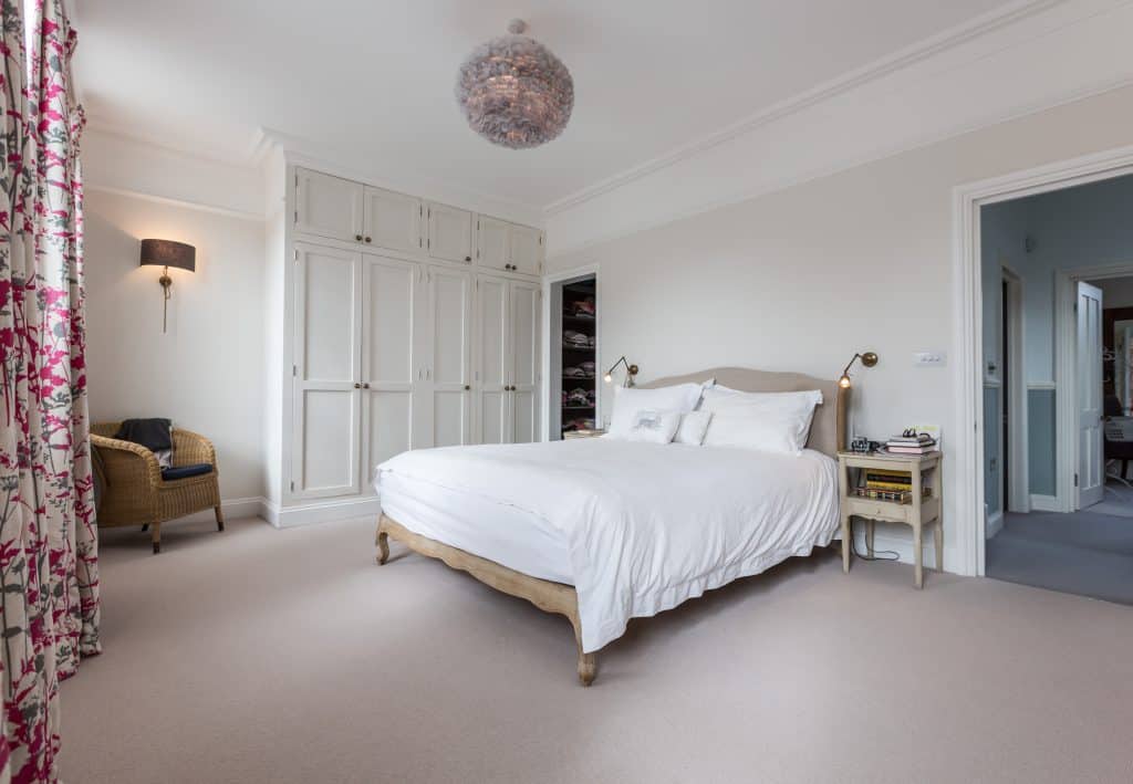 a bedroom with a bed in a room