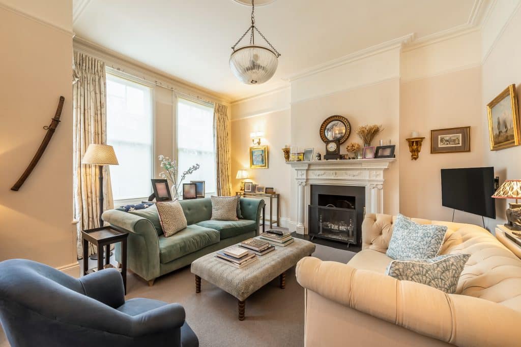 a living room filled with furniture and a fireplace