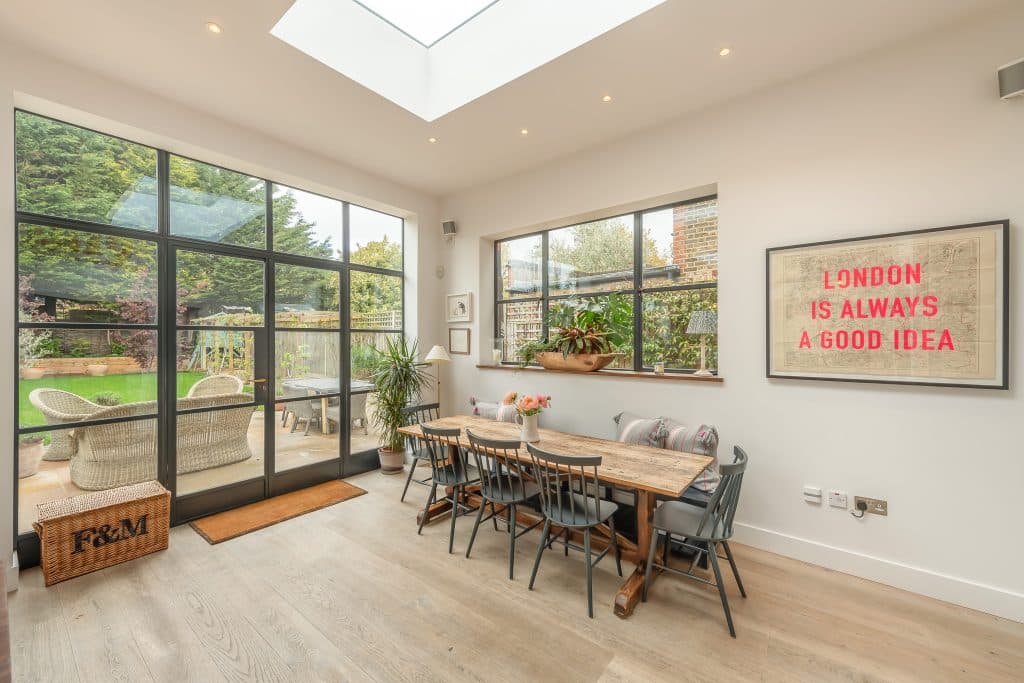 a living room filled with furniture and a large window