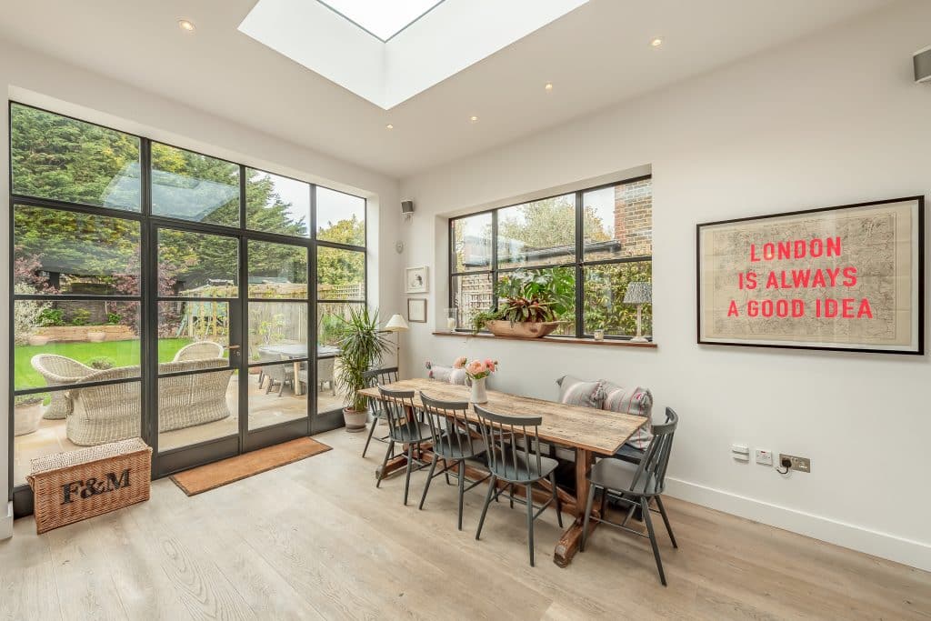 a living room filled with furniture and a large window
