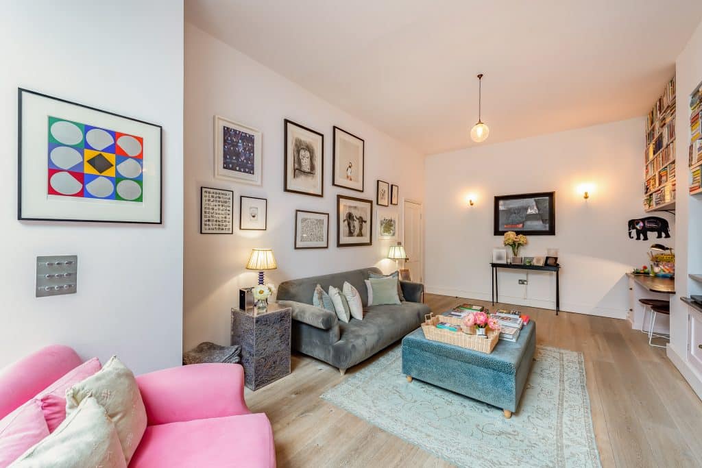 a living room filled with furniture and a flat screen tv