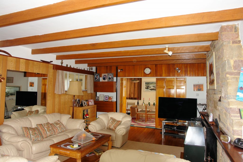 a living room filled with furniture and a table