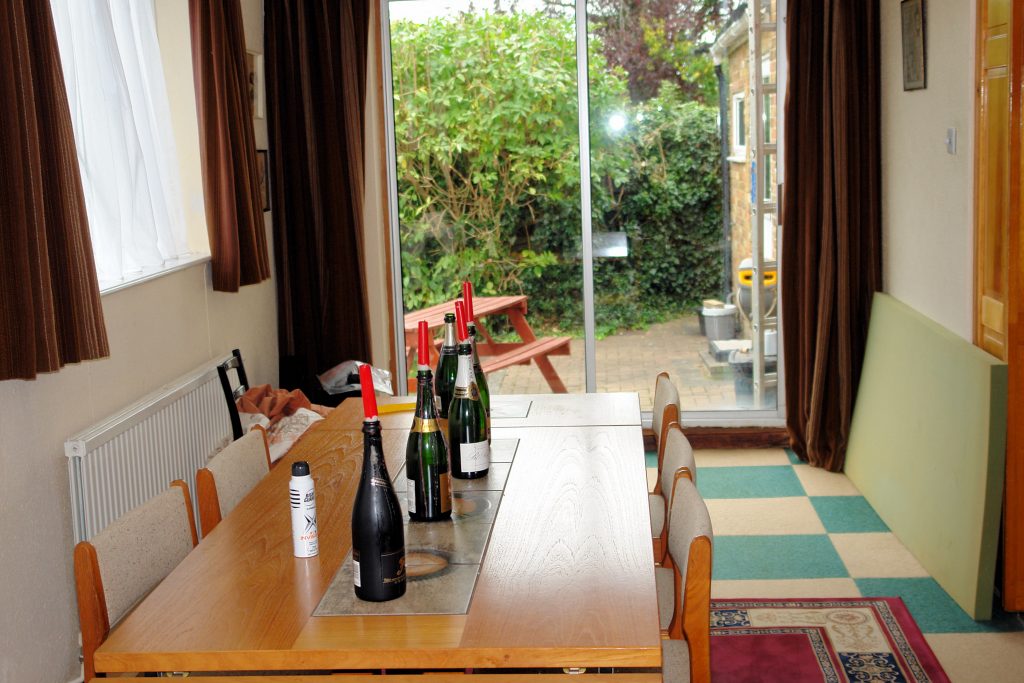 a dining room table in front of a window