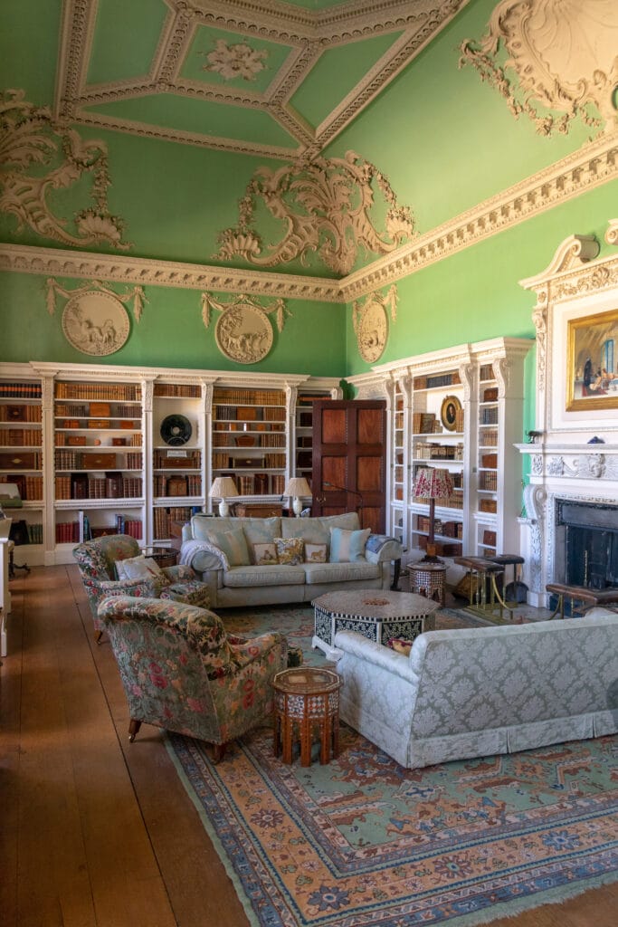a living room filled with furniture and a fire place