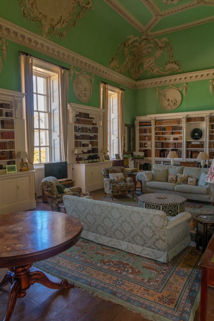 a living room filled with furniture and a fireplace