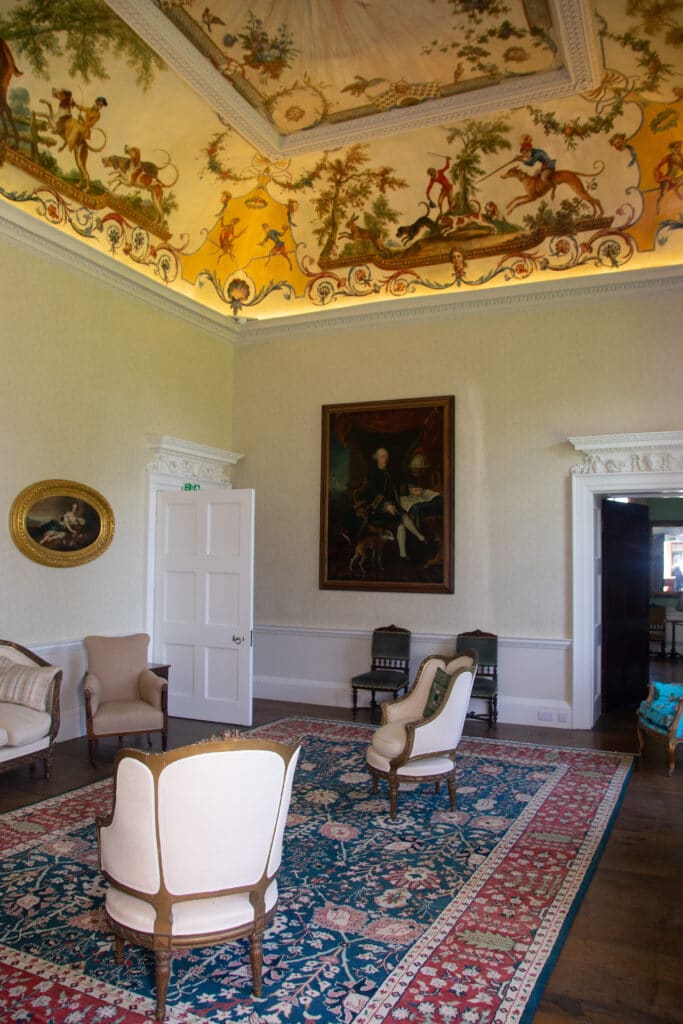 a living room filled with furniture and a fire place