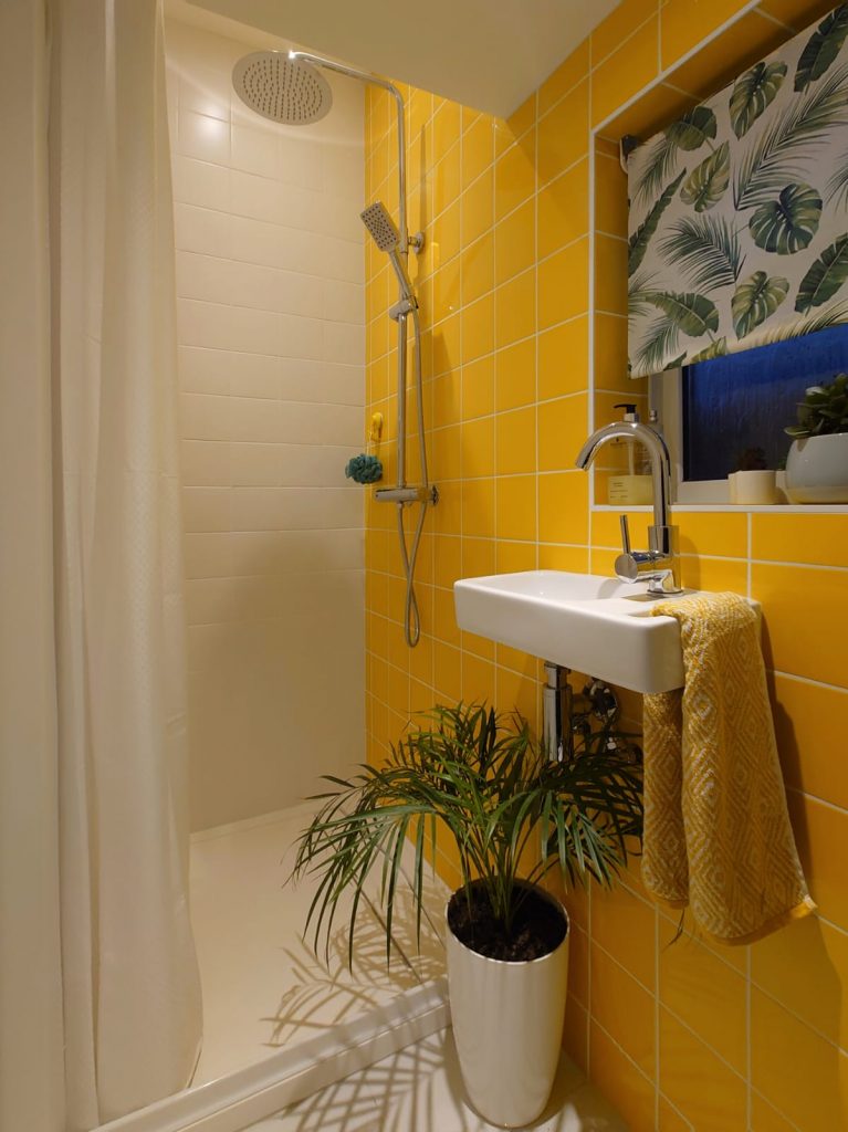a room with a sink and a mirror