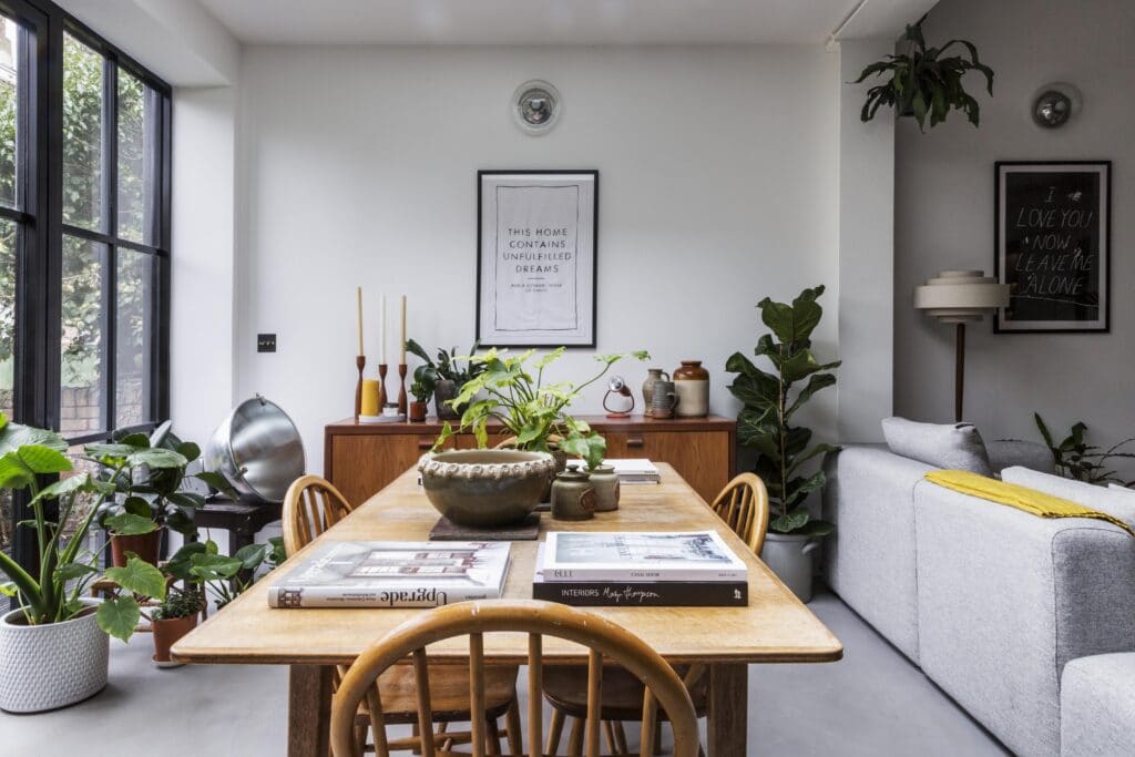 a living room filled with furniture and a large window