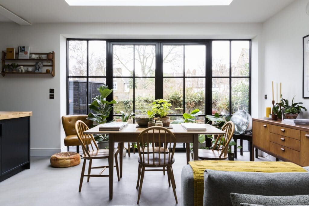a living room filled with furniture and a large window