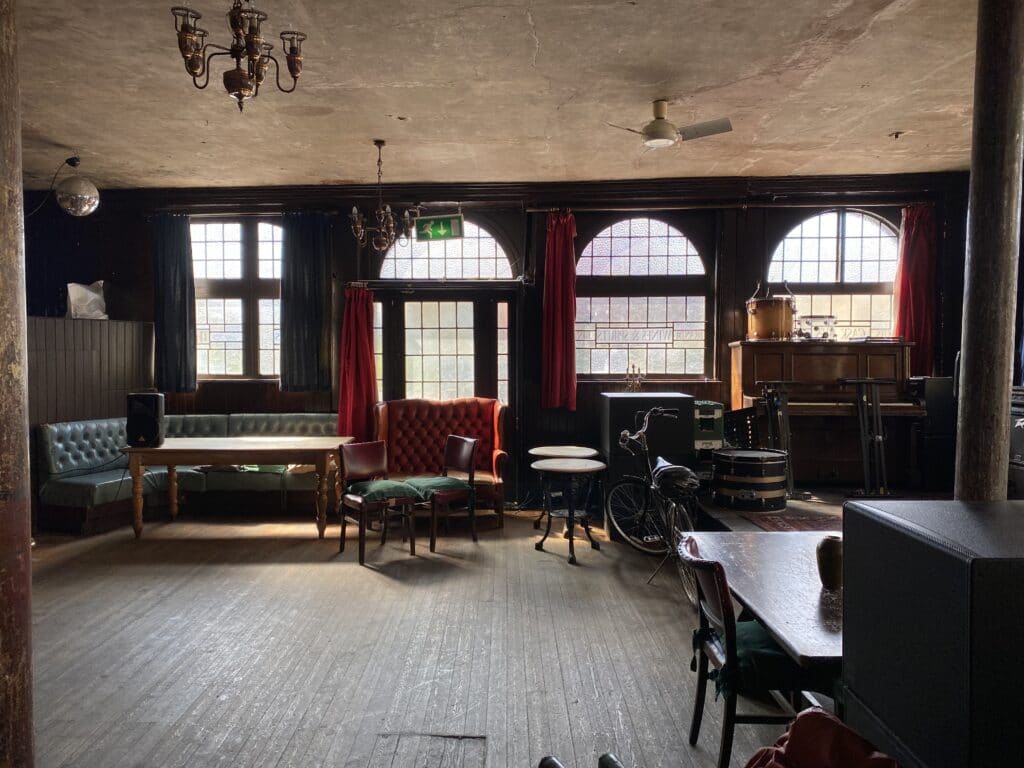 a living room filled with furniture and a large window