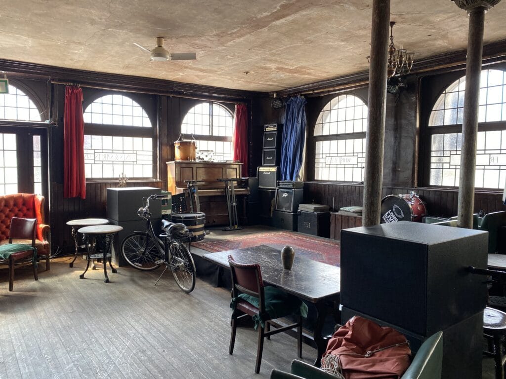 a living room filled with furniture and a large window