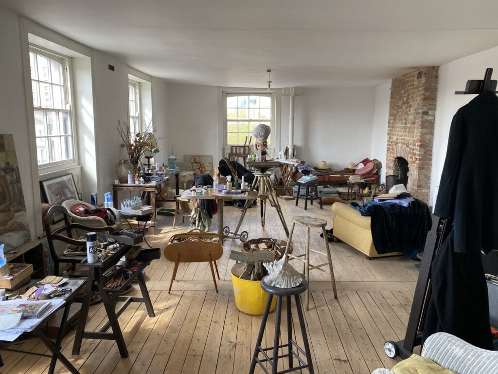a living room filled with furniture and a large window
