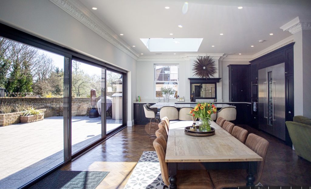 a living room filled with furniture and a large window