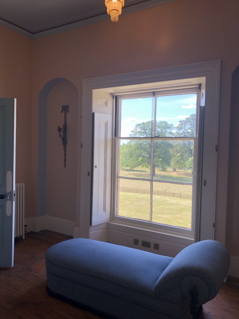 a view of a living room next to a window