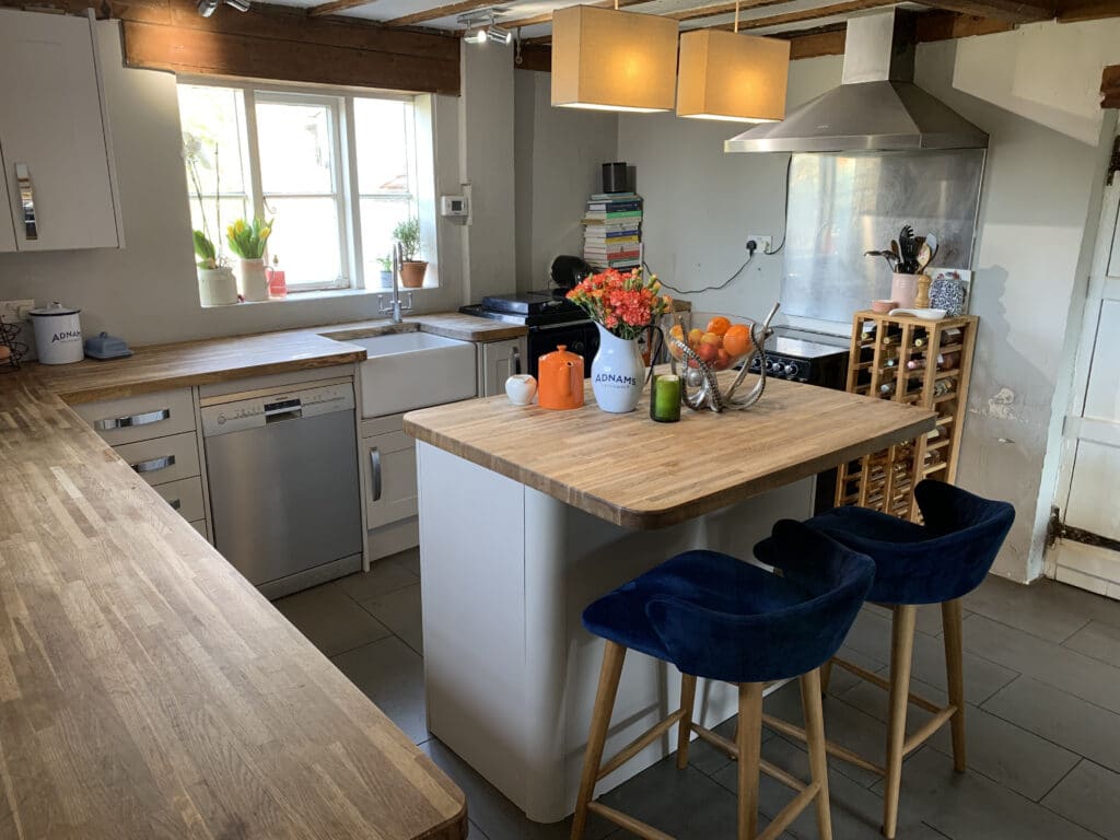 a kitchen with an island in the middle of a table