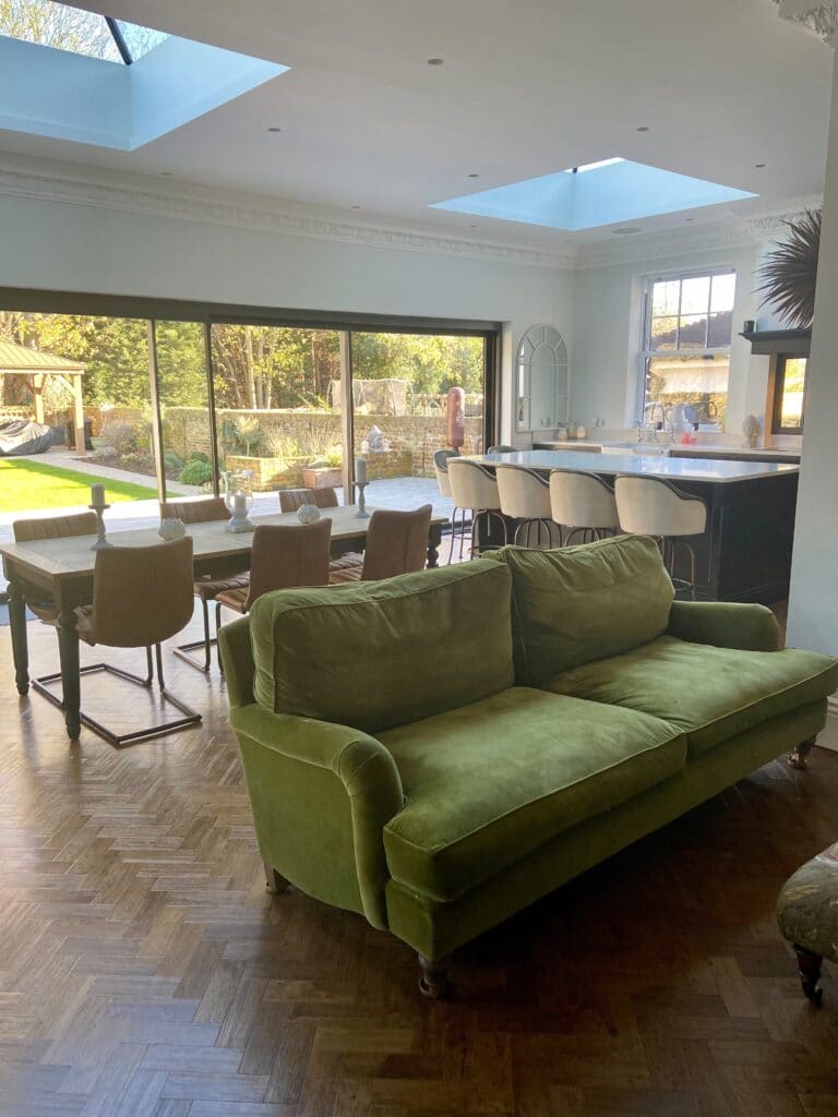 a living room filled with furniture and a large window