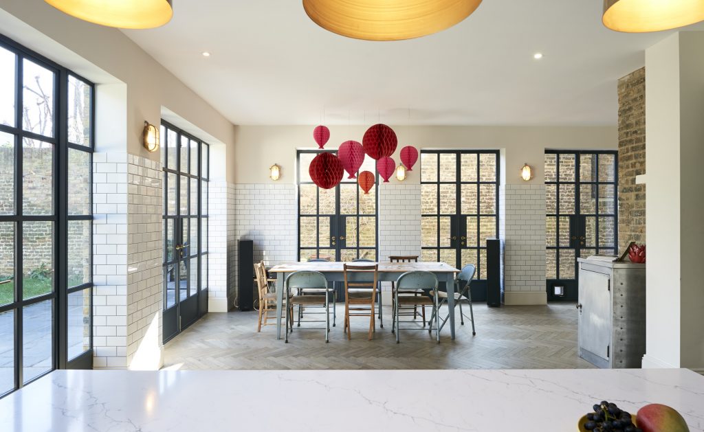 a living room filled with furniture and a large window