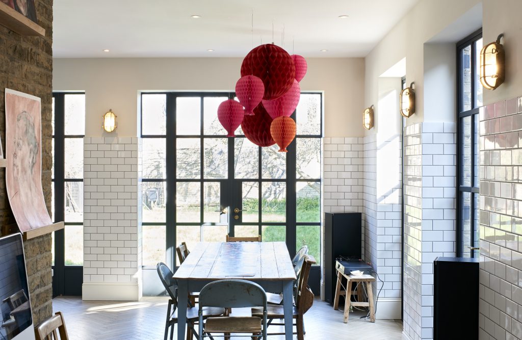 a room filled with furniture and a large window