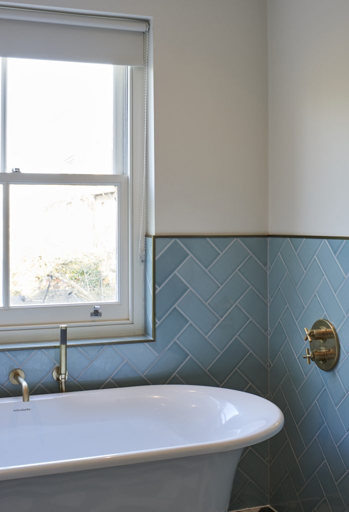 a sink sitting under a window