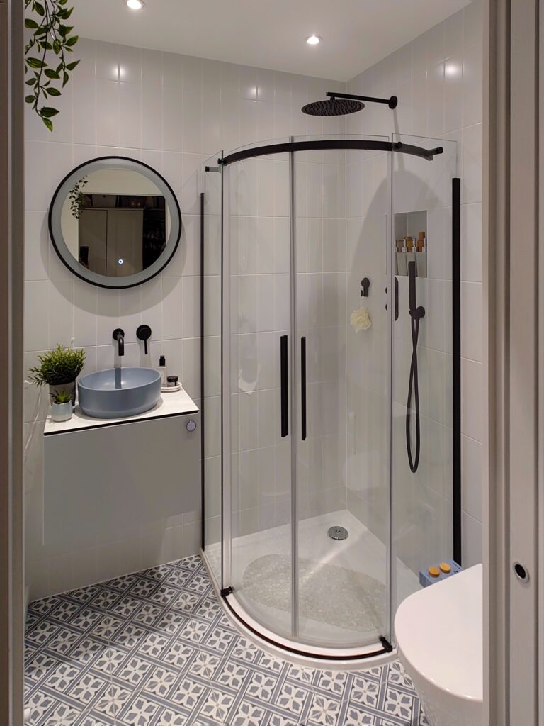 a room with a sink and a mirror