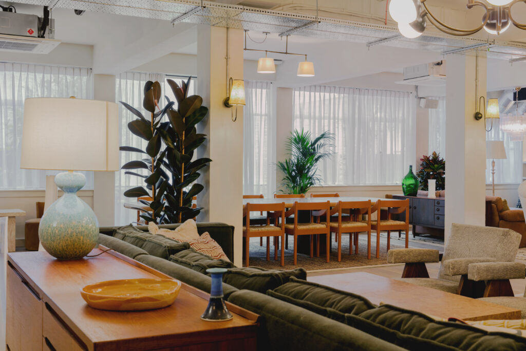 a living room filled with furniture and a large window