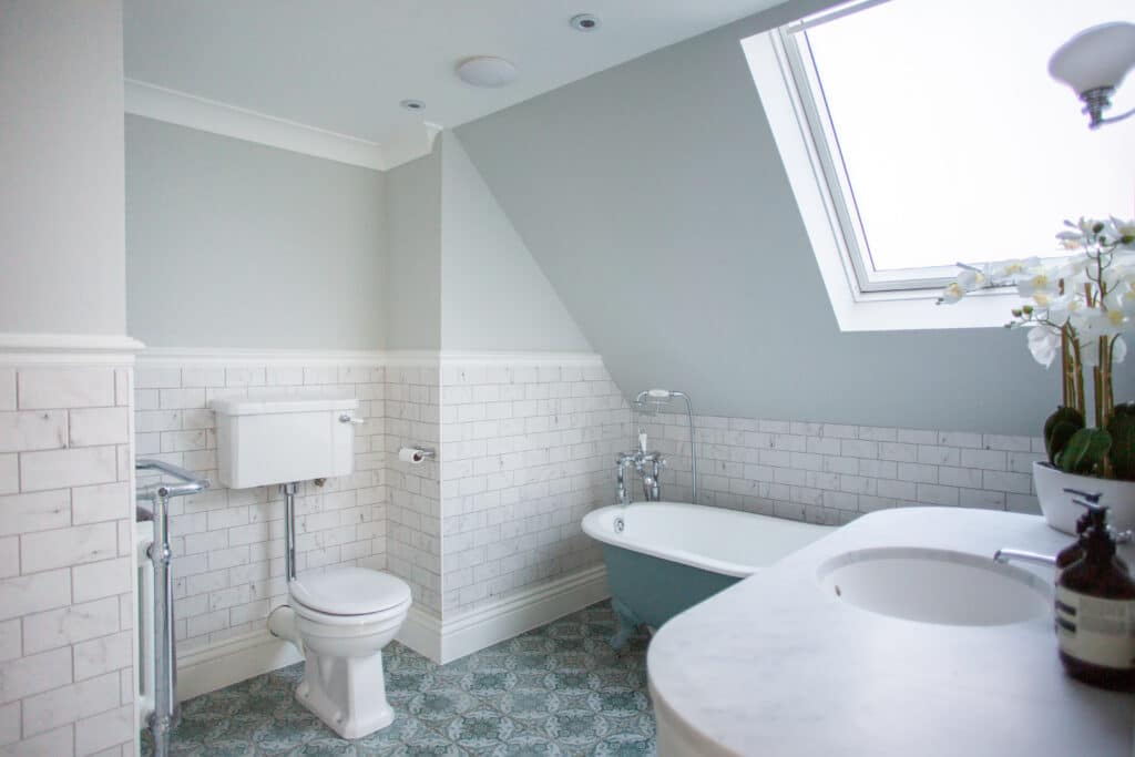 a room with a sink and a mirror