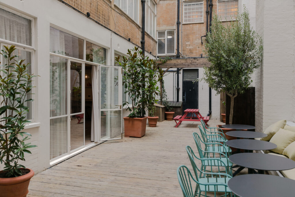a chair sitting in front of a building