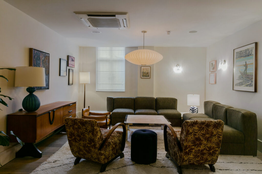 a living room filled with furniture and a fireplace