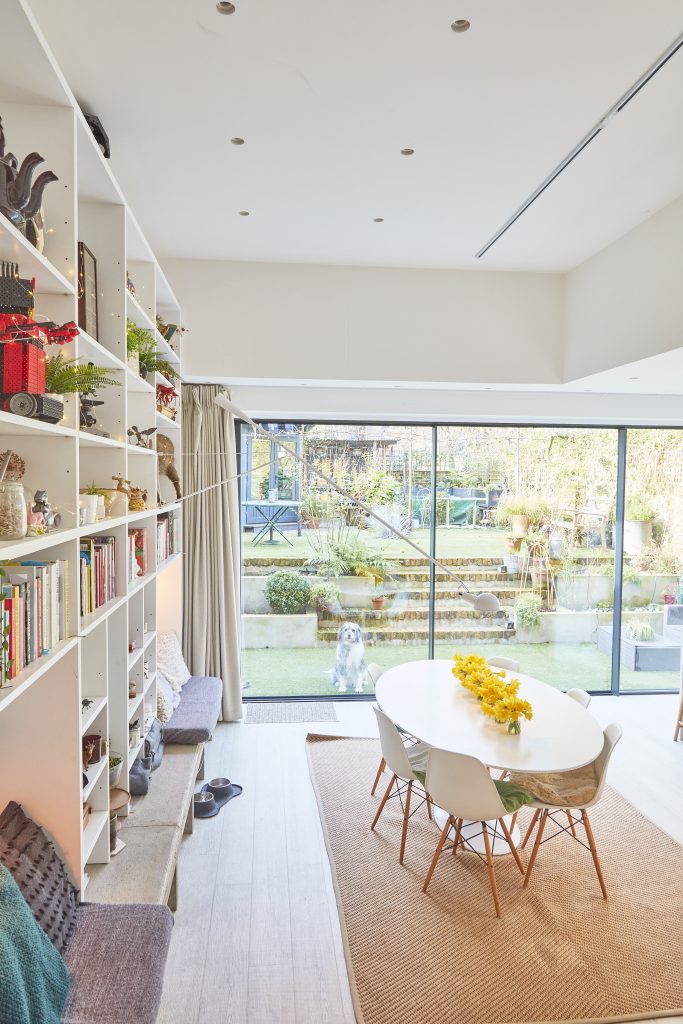 a living room filled with furniture and a large window